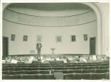 Man giving a speech in an auditorium, The University of Iowa, 1930s