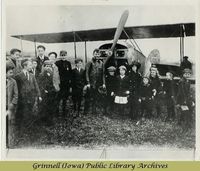 Billy Robinson with children and airplane 