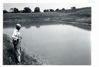 Frank Weiland viewing his pond, 1966