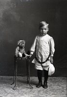 Boy with belt and teddy bear