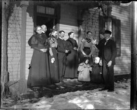 UP655 Eight adults and two children on porch