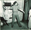 Drama student ready for a cue backstage, The University of Iowa, 1930s