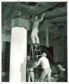 Greek fraternity members hanging streamers, The University of Iowa, 1950s