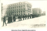 Commencement procession walking west on Washington St. with McLean Hall in background, The University of Iowa, June 1914
