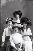 Four women in hats
