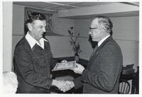 1976 Dwight Stucker aceepts award