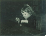 Small child playing at a table, The University of Iowa, 1920s