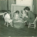 Girls and teacher with tub of water, The University of Iowa, January 1938
