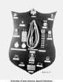 Military insignia and badges displayed on a board, The University of Iowa, 1933