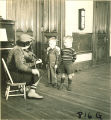 Boys listening to a woman play violin, The University of Iowa, January 12, 1938