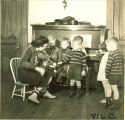 Woman playing violin for children, The University of Iowa, January 12, 1938