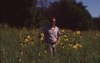 Eric Hoien Poses in Native CRP Field.