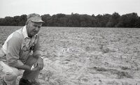 Unidentified farmer in parched field