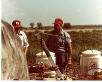 Two Farmers Setting Up Till Spraying