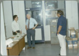 Earl O. Heady with Somnuk Sriplung and another official at the Office of Agricultural Economics in Bangkok, Thailand, 1983