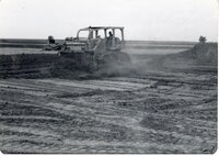 1970s Earthmoving machinery in field