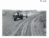 Harold Koch planting corn on strips, 1969