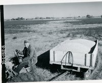 Wm. Vinzant and shelled corn in a trailer from his land, 1966