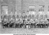 Rifle team with four trophies, The University of Iowa, ca. 1931