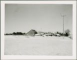 Barns and outbuildings on a snow-covered farm