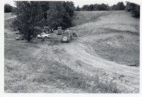 1970's Grassy field with machinery