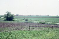 1986 Truck on road by grassy fields