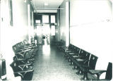 Seats from Zoology Building room 201 displaced for renovations and stacked in 2nd floor hallway, The University of Iowa, 1982