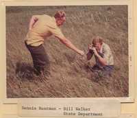 Dennis Rustman and Bill Welker Examine a Field.