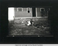 Heitzman and James boys plays with dogs