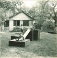 Children climbing on wood platforms and slides, The University of Iowa, May 28, 1941