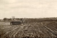 Tractor pulling grain drill
