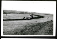 Onlookers watch as Tractors Plows at Dallas Davis Farm 