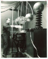 Physics student John Craven adjusting electron gun, The University of Iowa, 1963