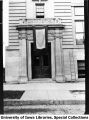 Engineering building entrance with flag bearing 129 stars, The University of Iowa, 1918