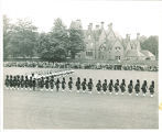 Scottish Highlanders marching on lawn, The University of Iowa, October 6, 1954