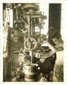Students working with large drill in engineering laboratory, The University of Iowa, 1939