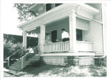 Students talking on the front porch of the Old International Center, the University of Iowa, June 1954