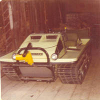 The Trackester snow plow parked in the barn