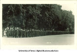 Commencement procession walking south on Clinton Street and turning west towards Old Capitol, The University of Iowa, June 6, 1922