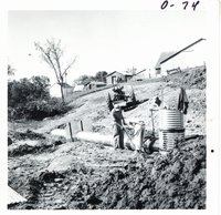 Installing pipe spillway on Harvey Michel land, 1968