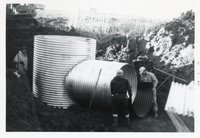 Four Men Install Underground Pipes