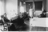 Nurse and patients in ward, Old Homeopathic Hospital, The University of Iowa, 1900s