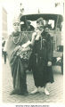 Marchers costumed as Native American and trapper in Mecca Day parade, The University of Iowa, 1921
