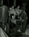 Checking a tractor carburetor, 1947
