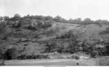 Overlying Saint Croix sandstone, fold and dip shows beyond Bridge, dark line above railway marking the base of the Oneota, Quandahl, Iowa, late 1890s or early 1900s