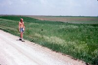 1986 Shirtless man in field
