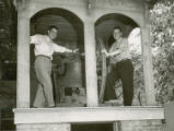 Homecoming Co-Chairmen Jerry Whittlesey and Dave Lebuhn beside the Victory Bell, 1954