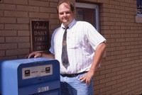 Jeff Lunquist in front of the Cherokee Daily Times.
