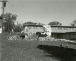 Delta Tau Delta's lawn display, ""Fearless Cyclones Unmask Buffalo Threat,"" Homecoming, 1954