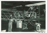 Engineering students working on airplane, The University of Iowa, August 1941